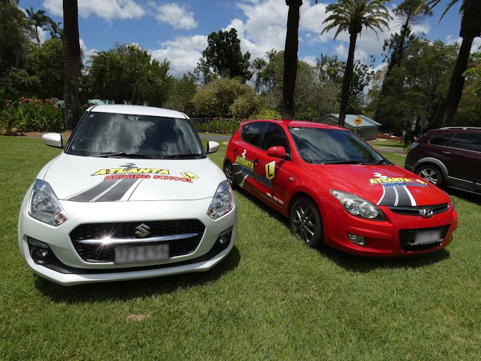 Atlanta Driving School instructor teaching a learner driver behind the wheel of the dual-controlled training car in Rockhampton